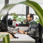 smaXtec employee working at desk