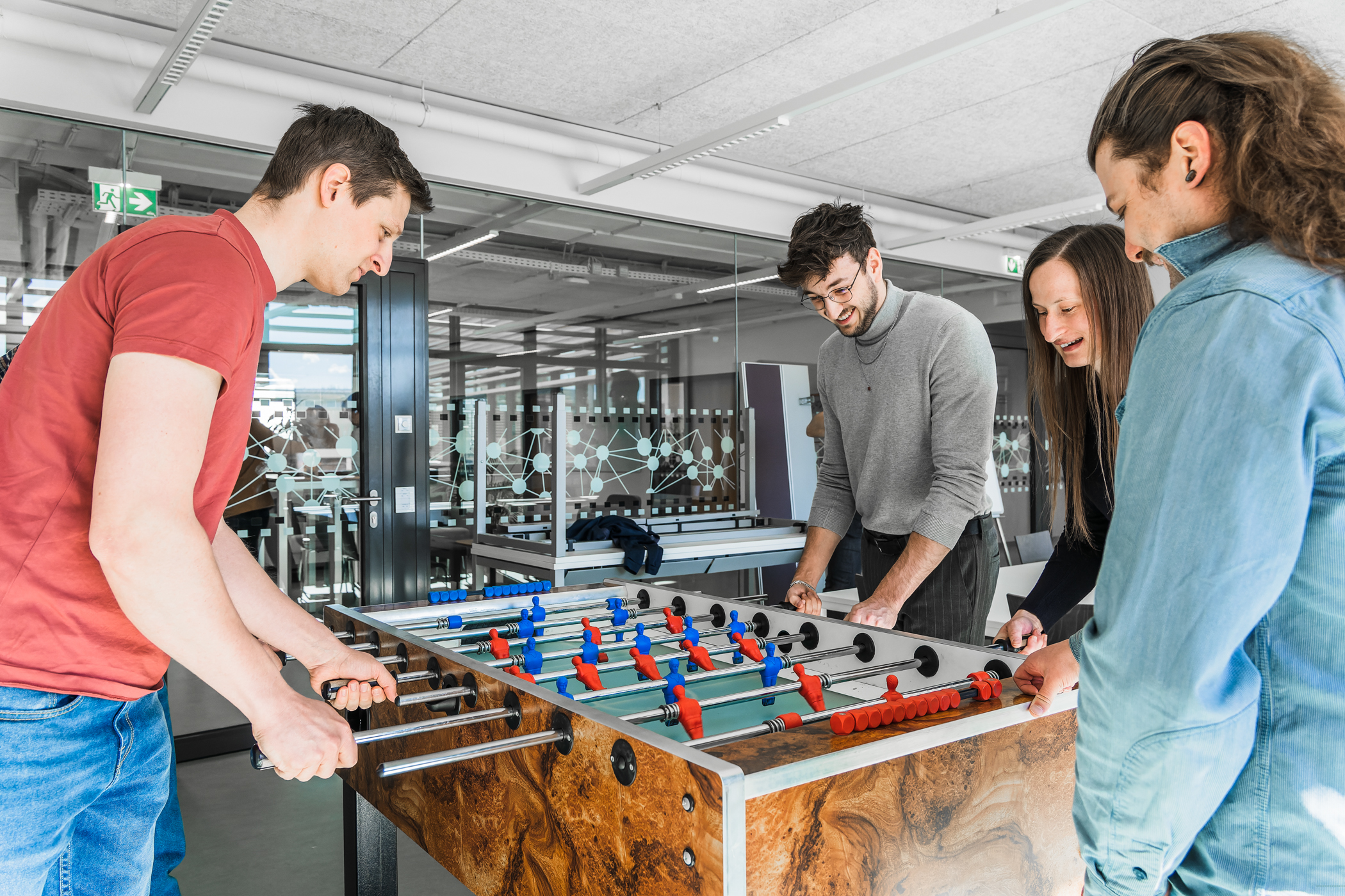 smaXtec employees playing table football during the break
